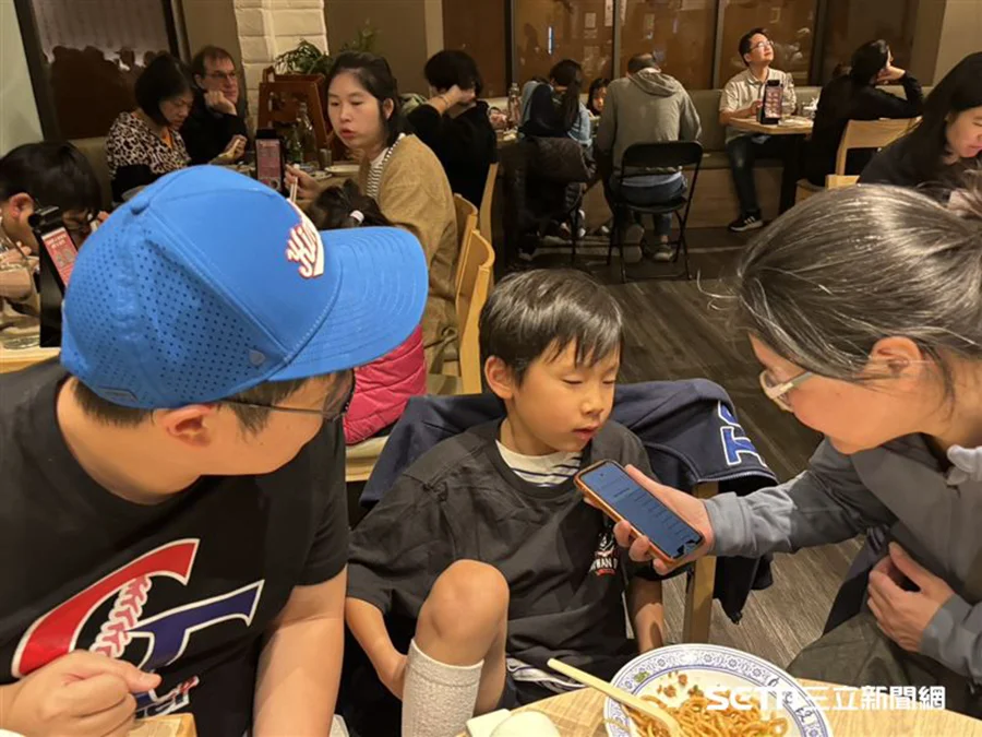 Families and children cheering for Team Taiwan during a World Baseball Classic watch party at Duan Chun-Chen Beef Noodles restaurant in Northern California