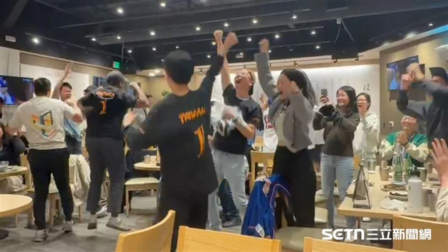 Taiwanese fans cheering and celebrating during a World Baseball Classic watch party at Duan Chunzhen Beef Noodles restaurant in Northern California