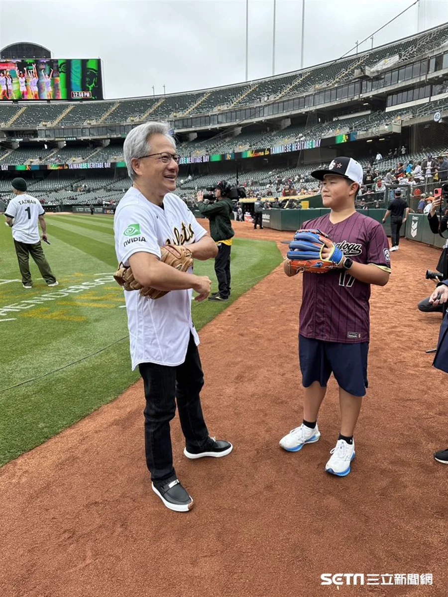 NVIDIA CEO Jensen Huang watching a baseball game from the stands